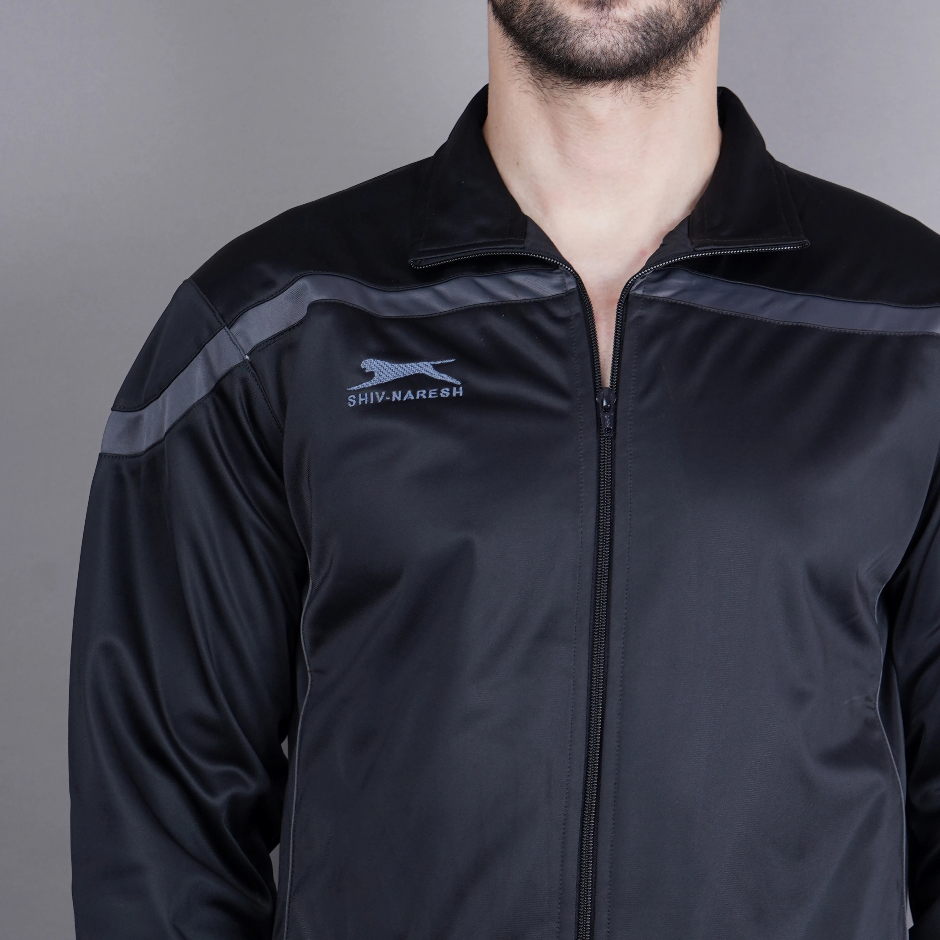 Men's black and dark grey athletic tracksuit